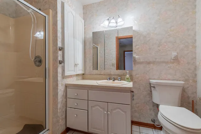 a view of empty room with a fireplace