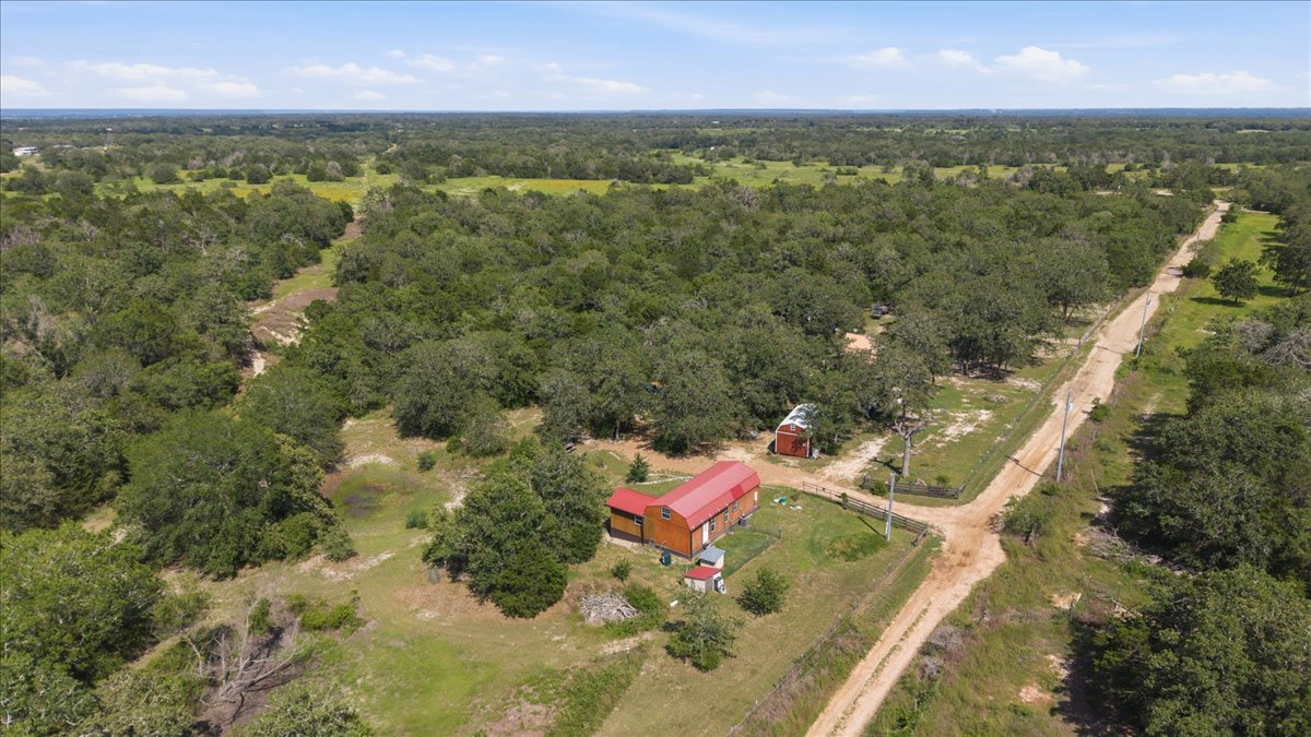 1705 Makinson Road West Point, TX 78963 - Photo 30 of 40 A sprawling rural landscape offers a secluded retreat with a charming barn structure and ample space for privacy.