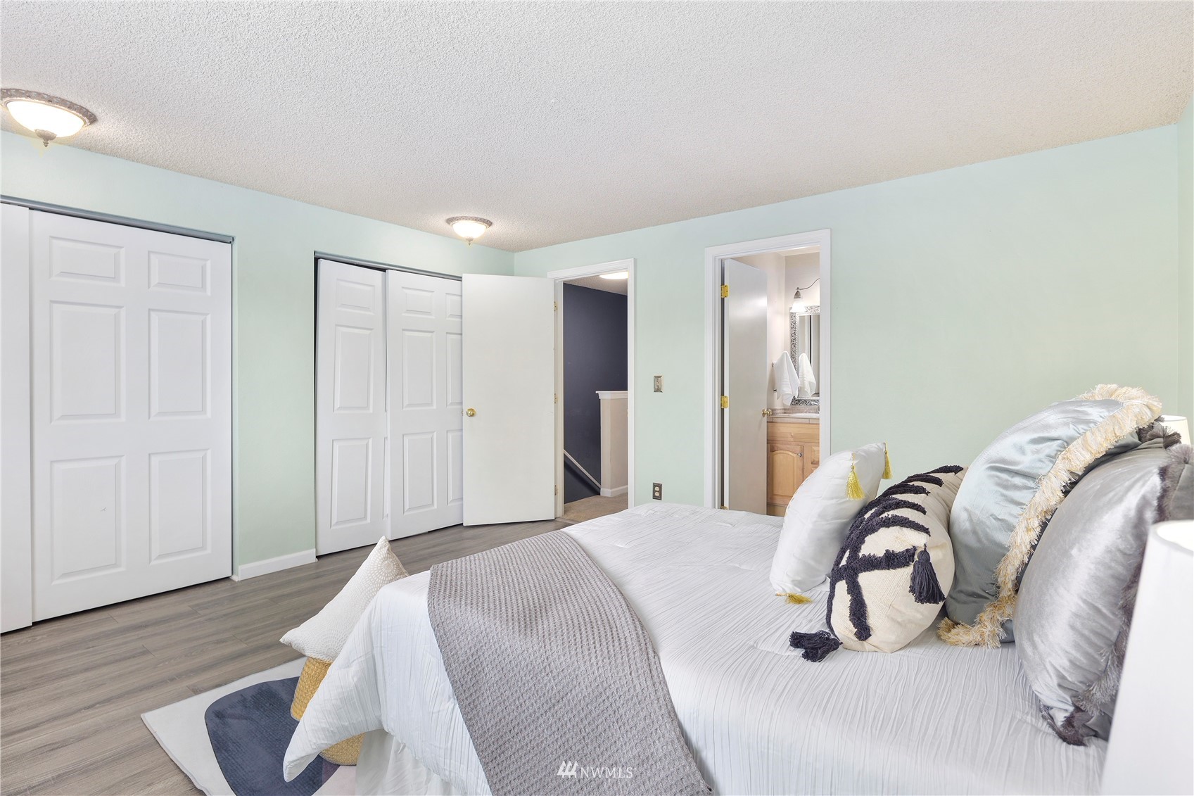 21527 4th Avenue West, Unit C44 Bothell, WA 98021 - Photo 17 of 40 a bedroom with a bed and a lots of light