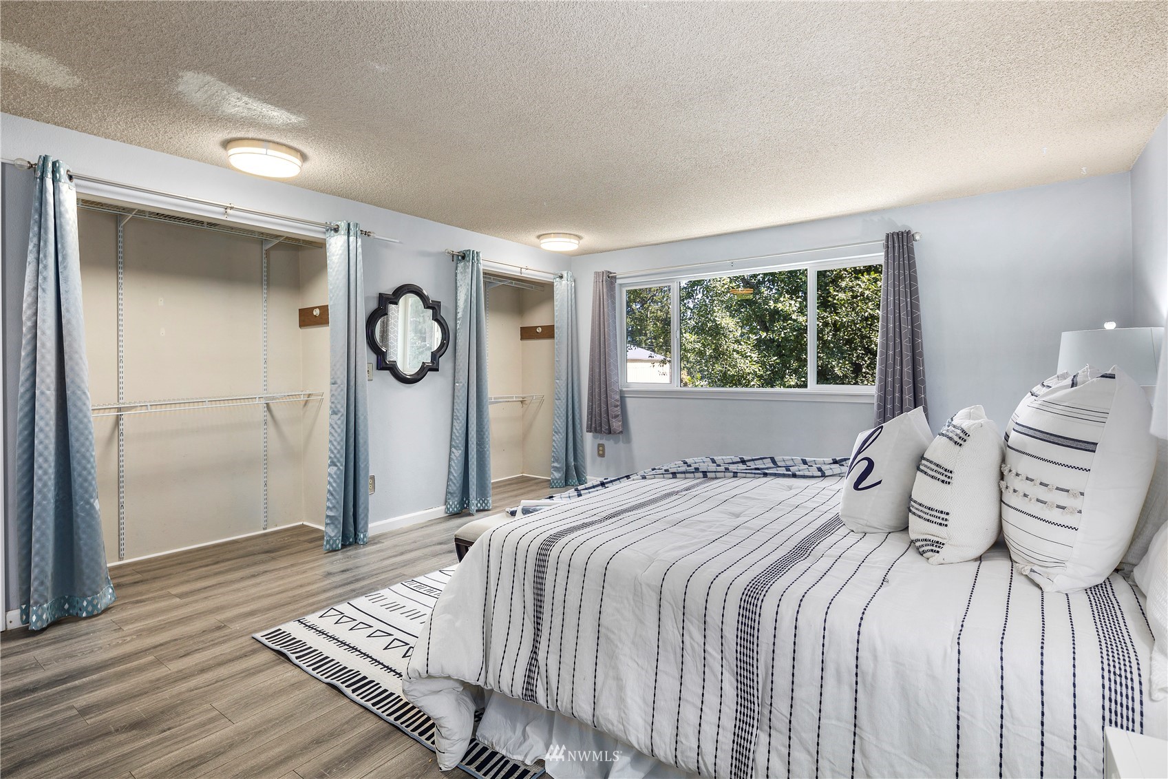 21527 4th Avenue West, Unit C44 Bothell, WA 98021 - Photo 19 of 40 a bedroom with a bed and a window