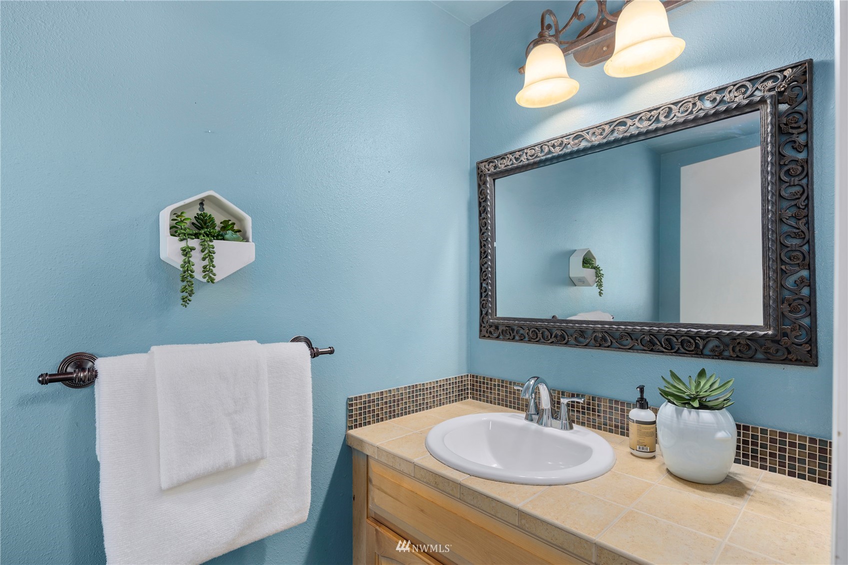 21527 4th Avenue West, Unit C44 Bothell, WA 98021 - Photo 20 of 40 a bathroom with a sink mirror and vanity
