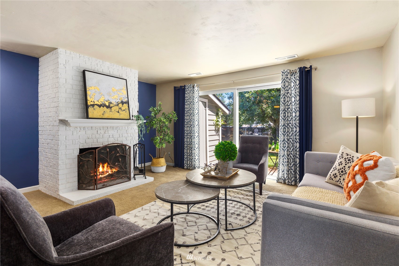 21527 4th Avenue West, Unit C44 Bothell, WA 98021 - Photo 2 of 40 a living room with furniture and a fireplace