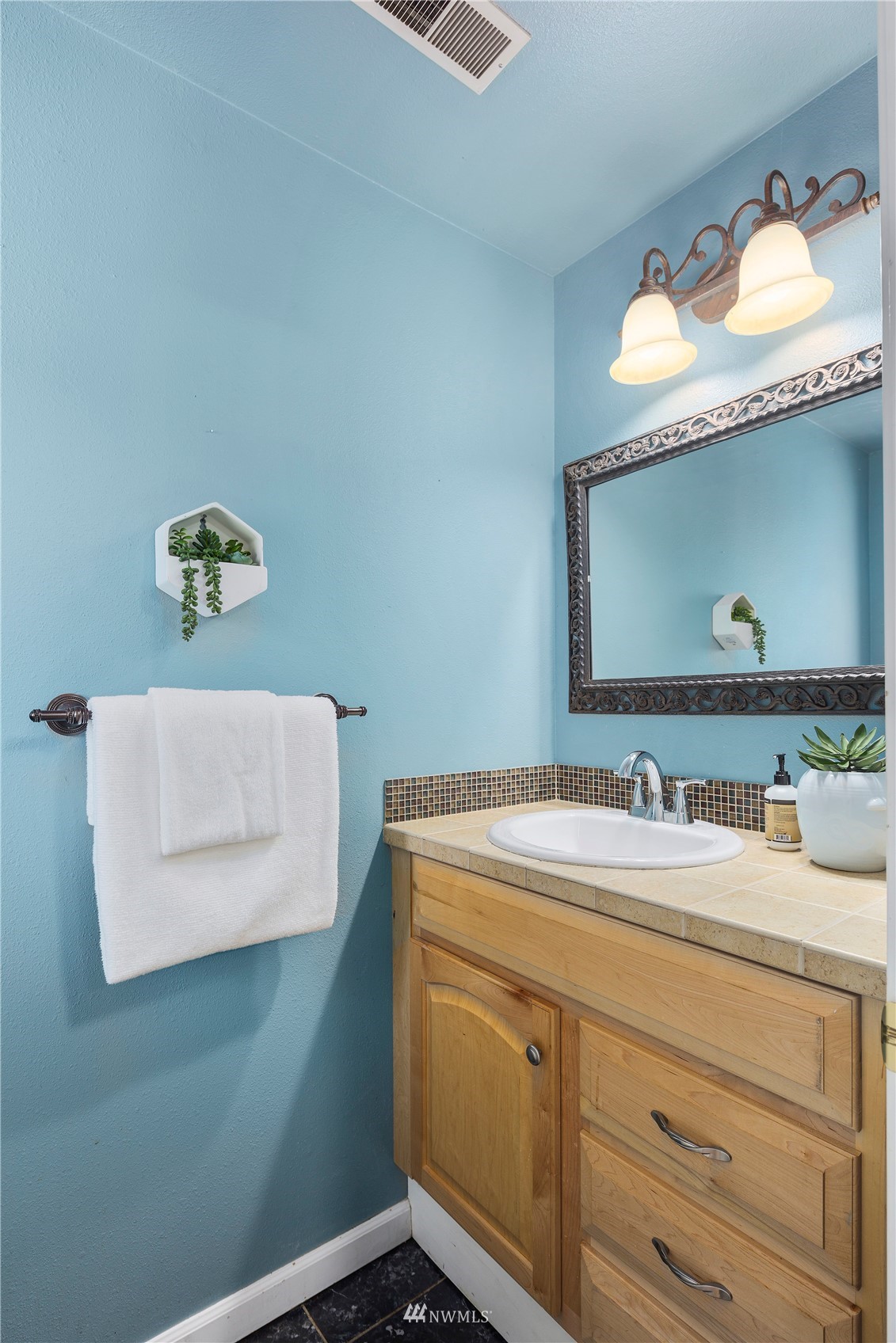 21527 4th Avenue West, Unit C44 Bothell, WA 98021 - Photo 23 of 40 a bathroom with a sink and a mirror