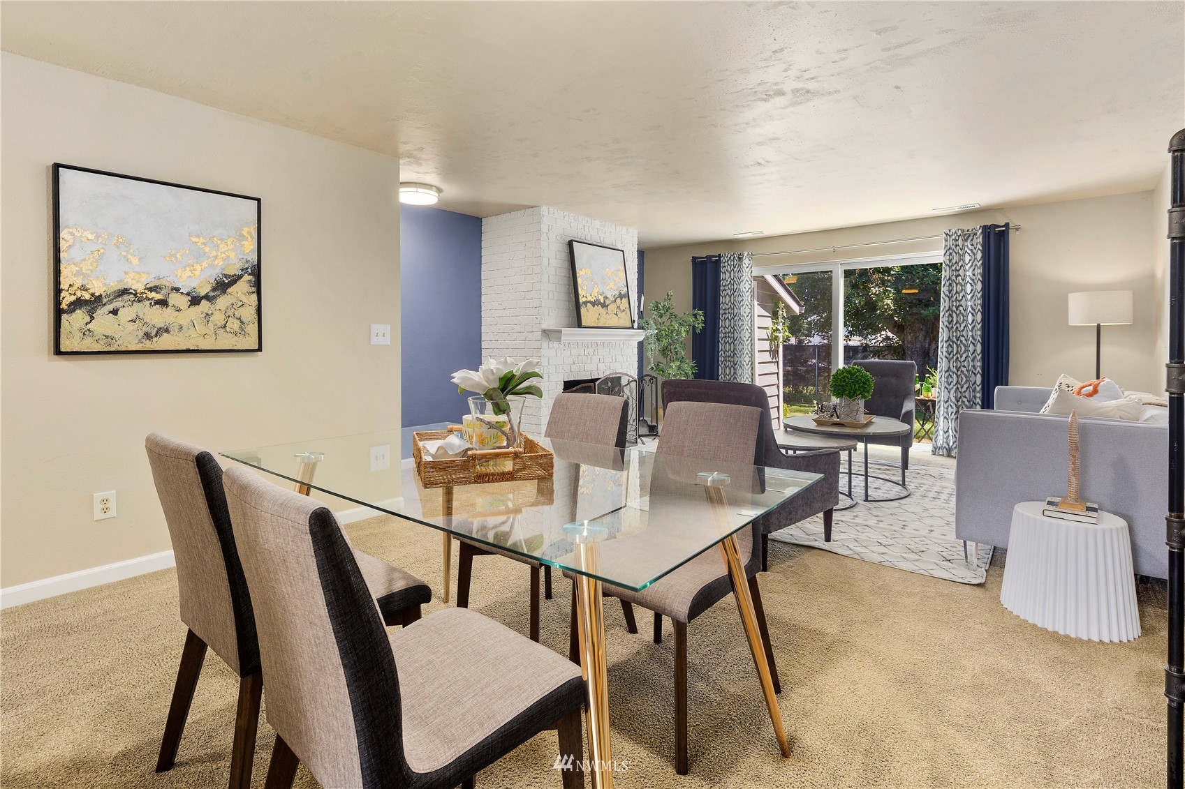 21527 4th Avenue West, Unit C44 Bothell, WA 98021 - Photo 4 of 40 a view of a dining room with furniture and a potted plant