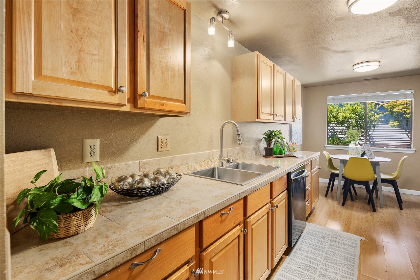 21527 4th Avenue West, Unit C44 Bothell, WA 98021 - Photo 8 of 40 a kitchen with stainless steel appliances granite countertop sink stove top oven and cabinets
