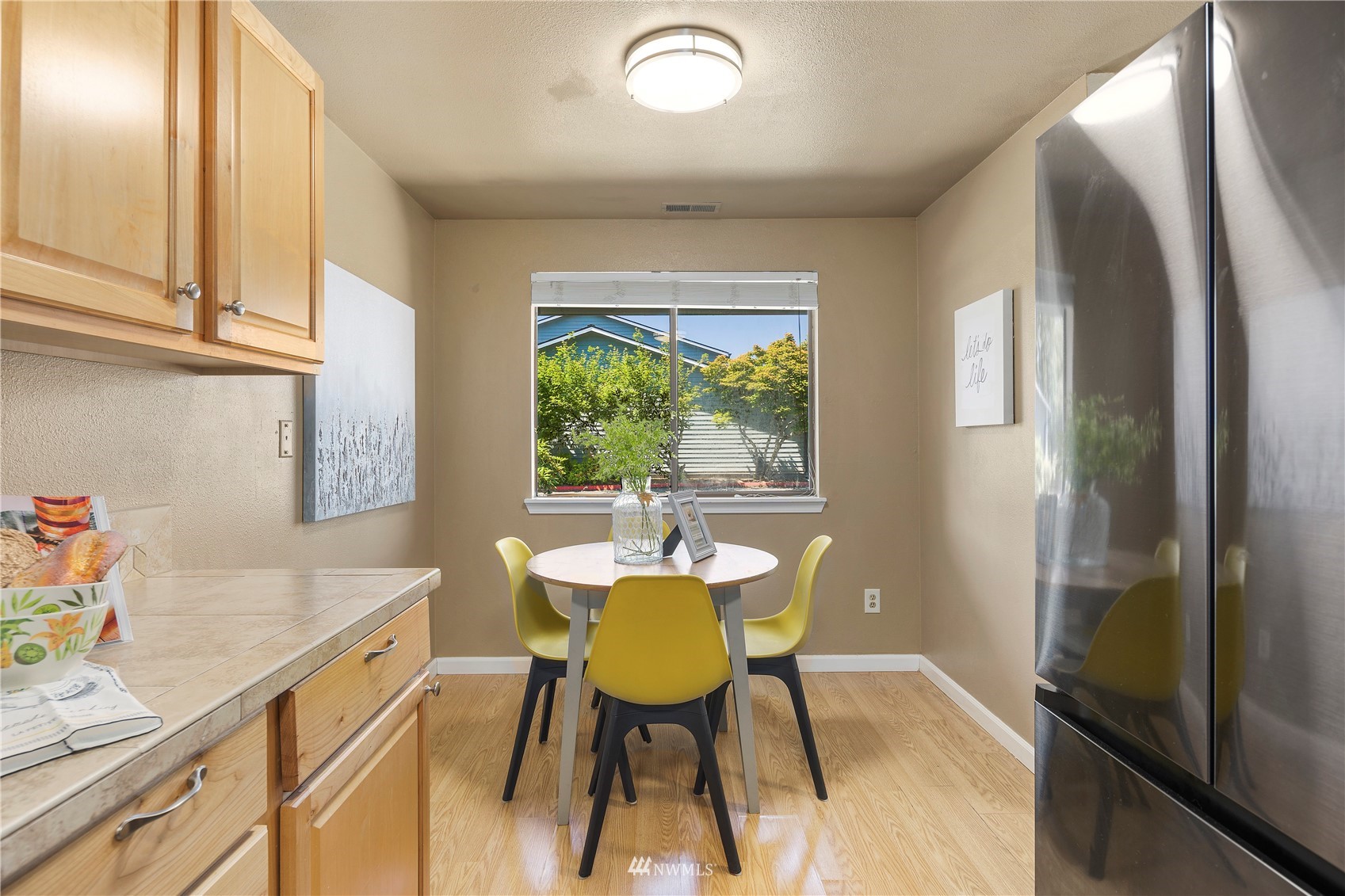 21527 4th Avenue West, Unit C44 Bothell, WA 98021 - Photo 10 of 40 a view of a dining room with furniture window and outside view