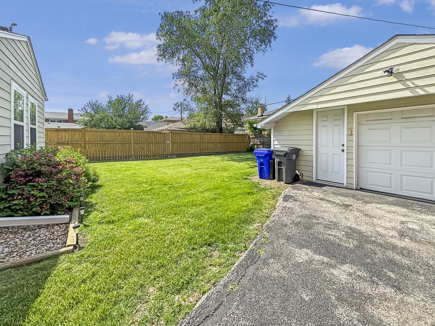 8538 45th Street Lyons, IL 60534 - Photo 23 of 29 a view of a backyard with a garden and plants