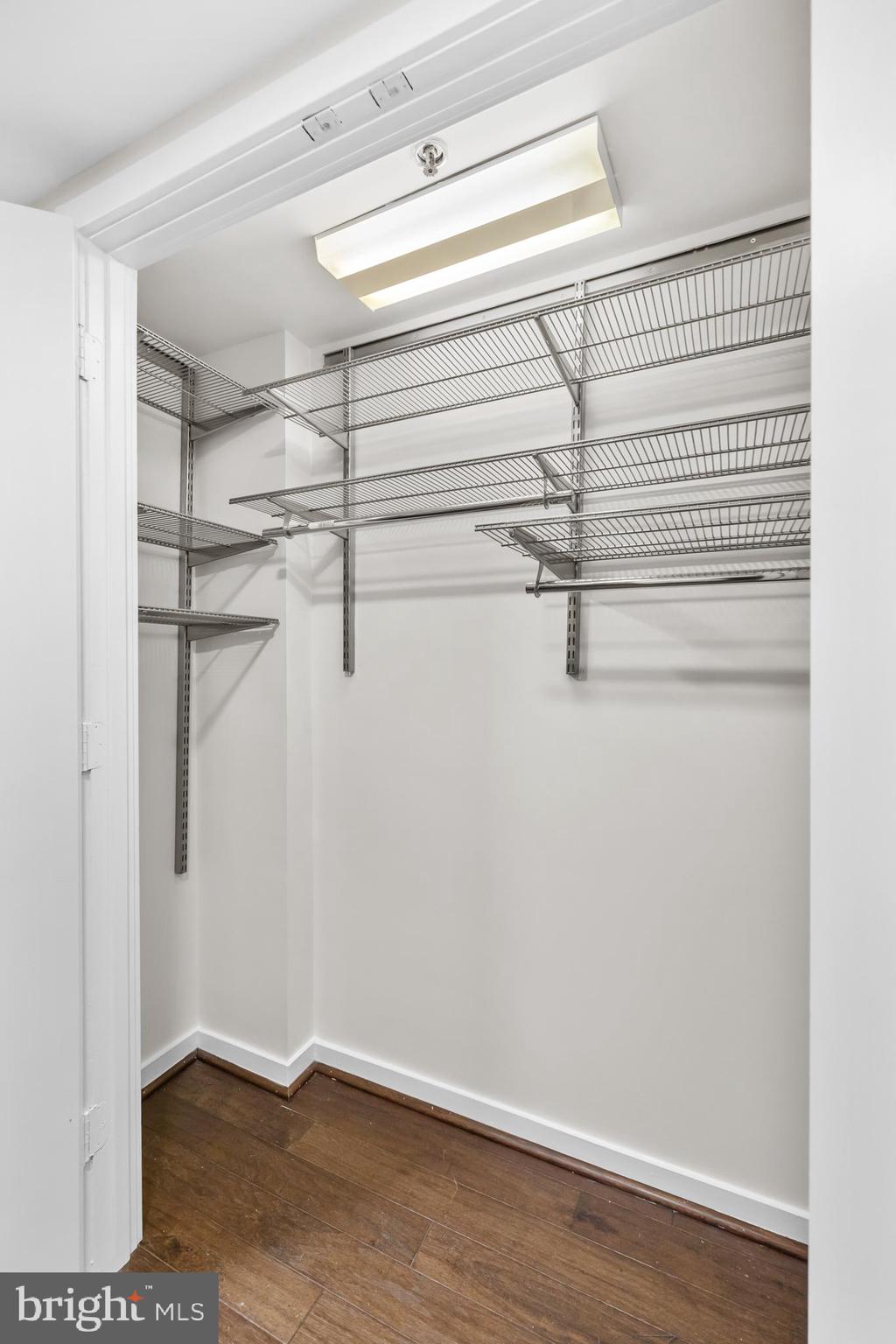 1275 25th Street Northwest, Unit 701 Washington, DC 20037 - Photo 21 of 36 a view of a room with racks on the wall