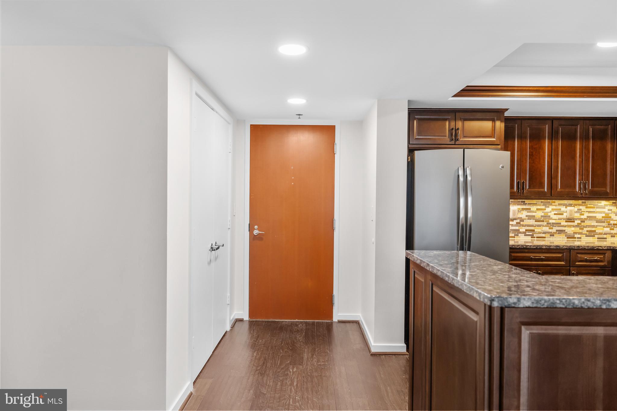 1275 25th Street Northwest, Unit 701 Washington, DC 20037 - Photo 3 of 36 a view of a kitchen with stainless steel appliances granite countertop cabinets and a refrigerator