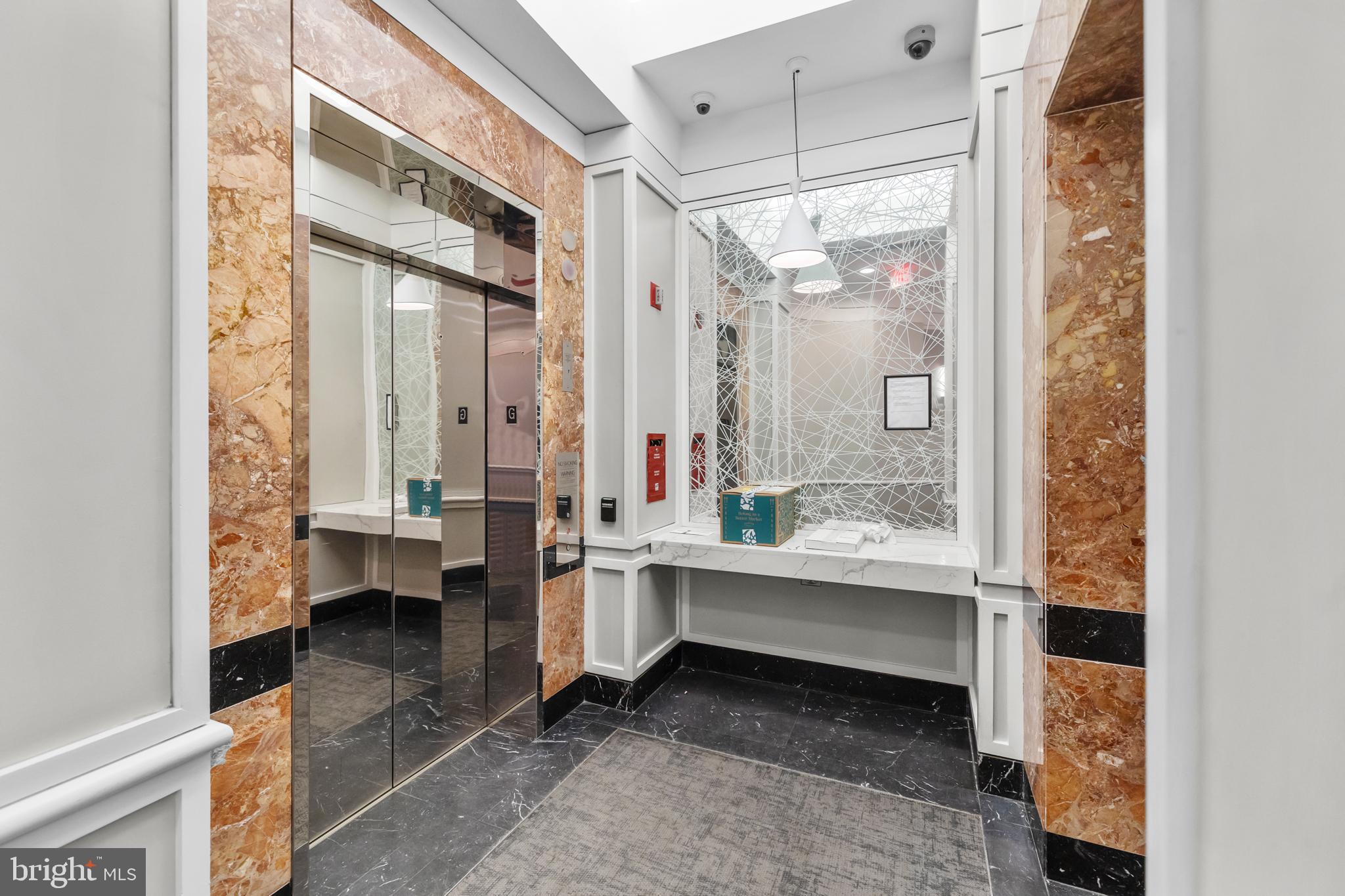 1275 25th Street Northwest, Unit 701 Washington, DC 20037 - Photo 33 of 36 a bathroom with a double vanity sink toilet and shower
