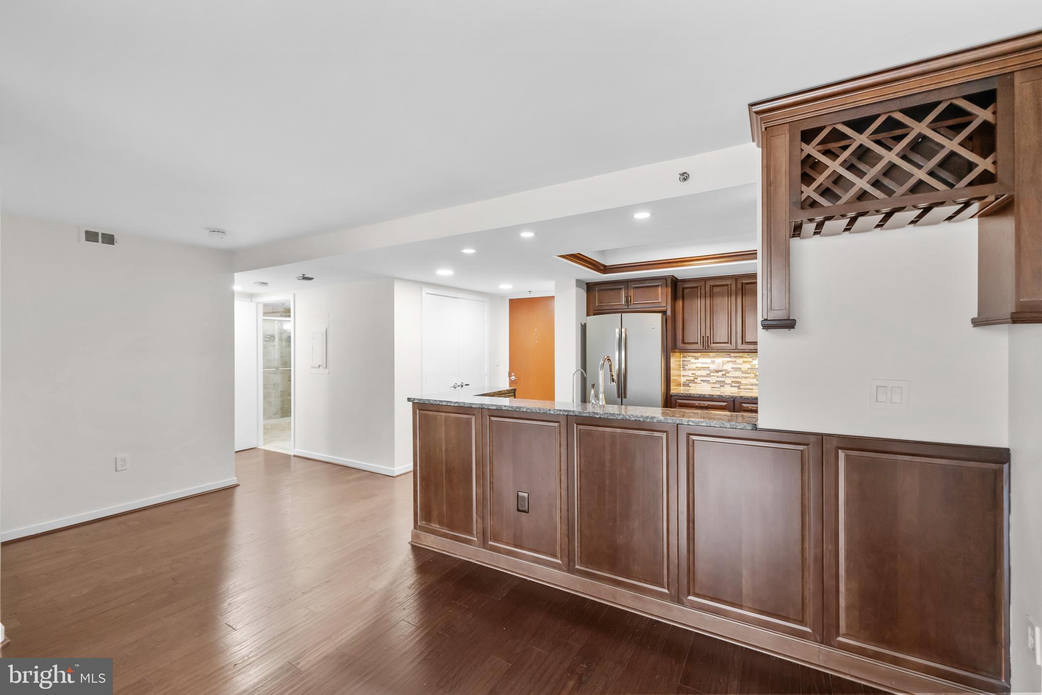1275 25th Street Northwest, Unit 701 Washington, DC 20037 - Photo 8 of 36 a view of kitchen with wooden floor