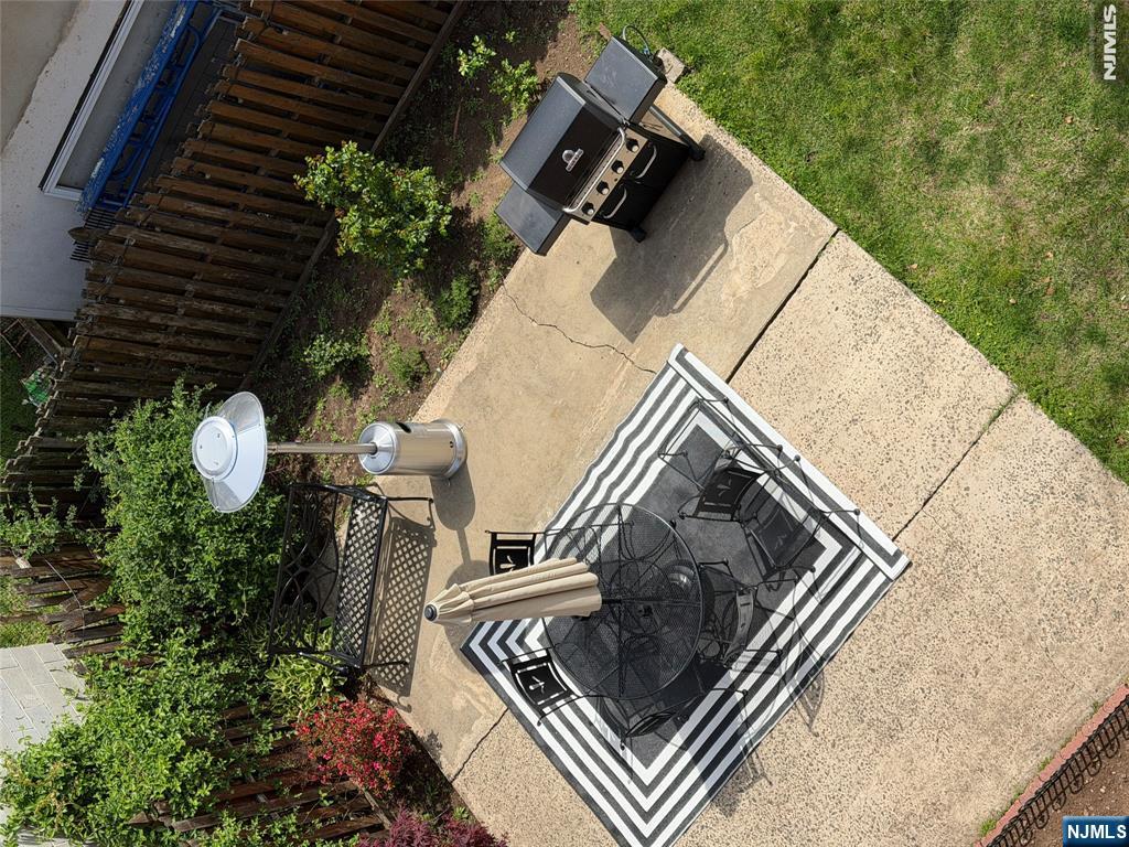215 Orient Way, Unit C2 Rutherford, NJ 07070 - Photo 23 of 25 a backyard of a house with yard fountain and outdoor seating