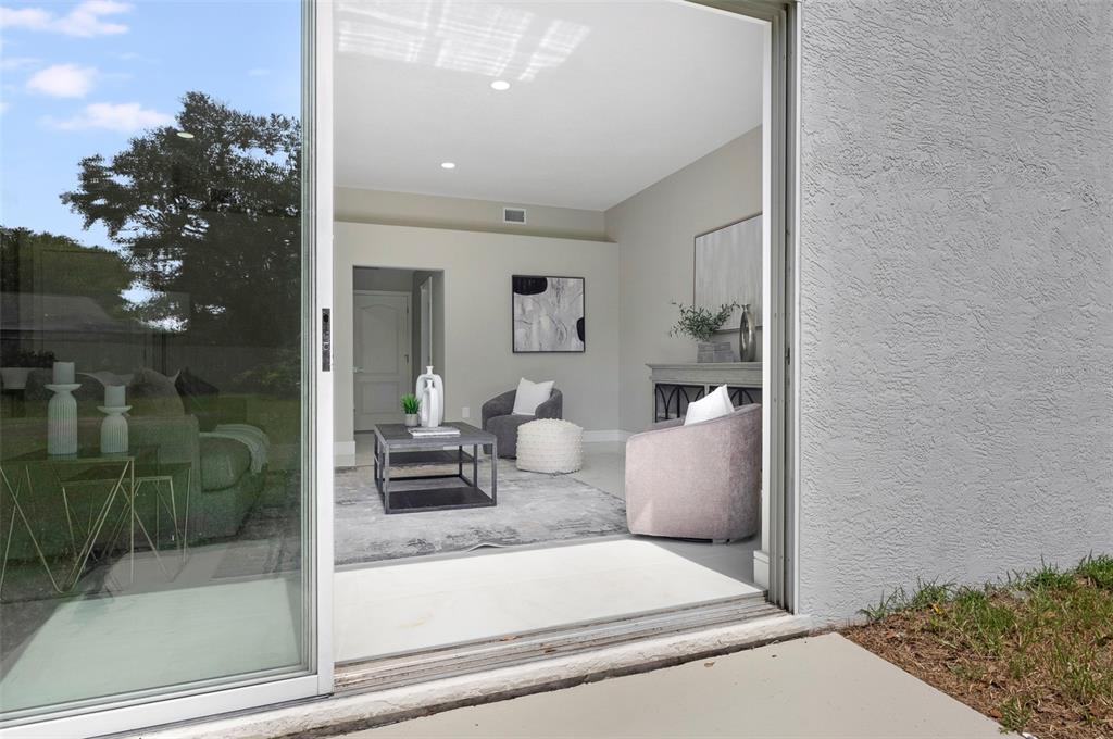 2306 Colusa Lane Valrico, FL 33596 - Photo 18 of 50 a view of living room filled with furniture and flowers