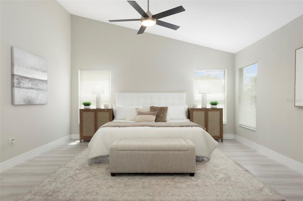 2306 Colusa Lane Valrico, FL 33596 - Photo 24 of 50 a bedroom with a bed and ceiling fan