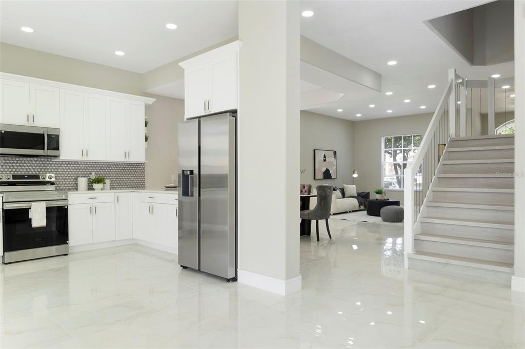2306 Colusa Lane Valrico, FL 33596 - Photo 28 of 50 a kitchen with refrigerator and cabinets