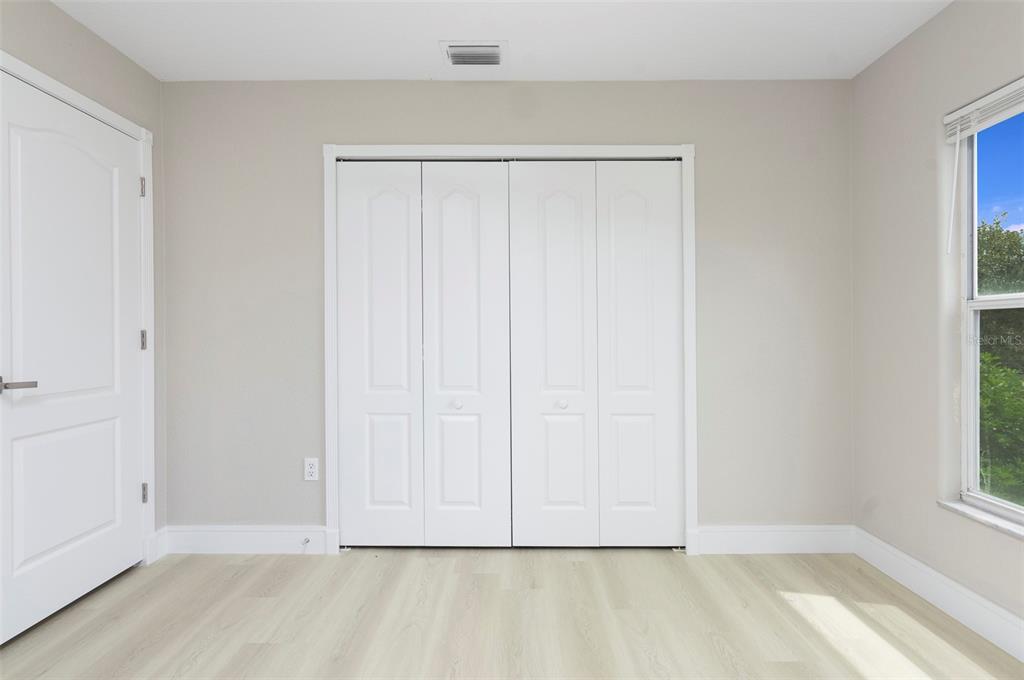 2306 Colusa Lane Valrico, FL 33596 - Photo 29 of 50 a view of an empty room with wooden floor