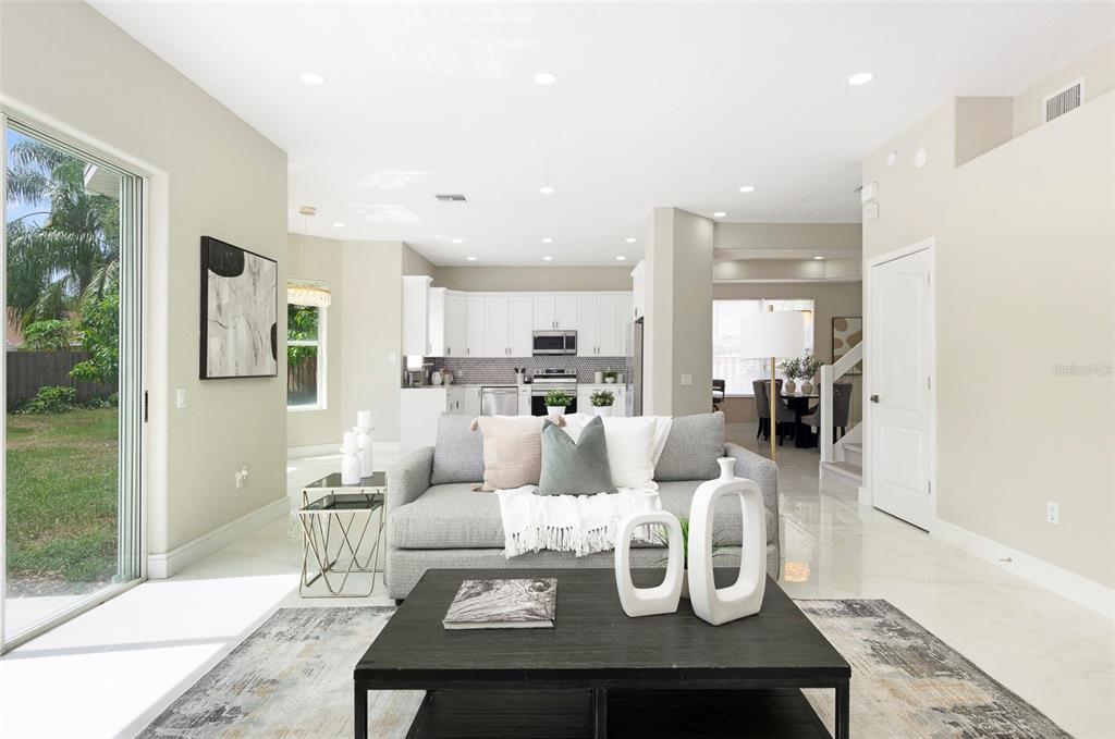 2306 Colusa Lane Valrico, FL 33596 - Photo 5 of 50 a living room with furniture kitchen view and a refrigerator