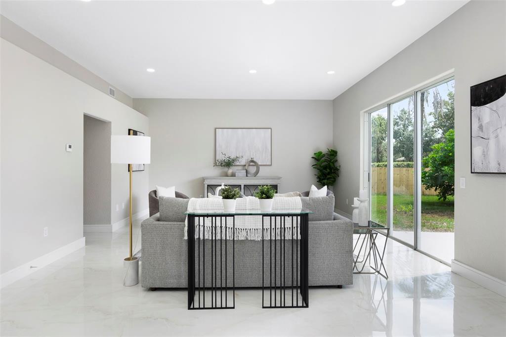 2306 Colusa Lane Valrico, FL 33596 - Photo 7 of 50 a bedroom with furniture a large window and front door