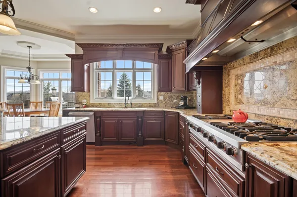 a living room with furniture a flat screen tv and a floor to ceiling window