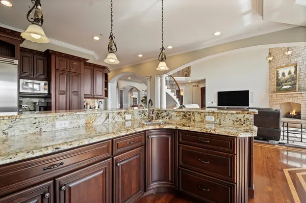 a view of entryway with wooden floor and a front door