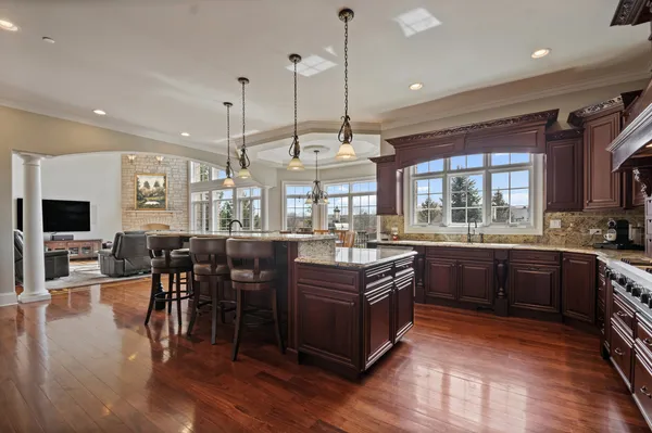 a living room with furniture and a fireplace or chandelier