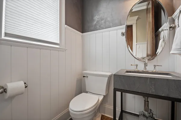 a bathroom with a sink and a large mirror