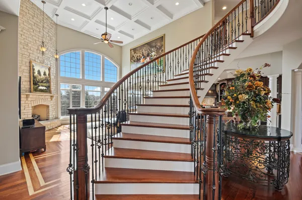 a living room with furniture and a painting