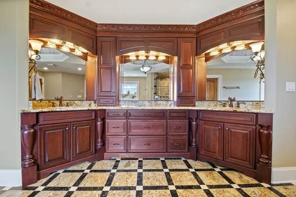 a view of a house with backyard porch and sitting area