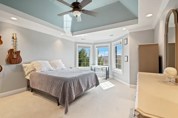 a view of a house with backyard patio and swimming pool