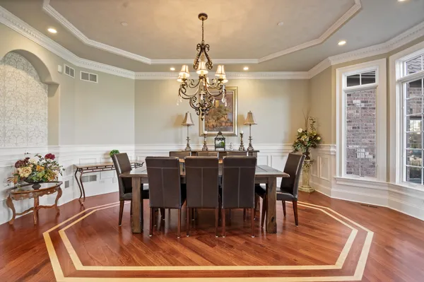a living room with fireplace furniture and a wooden floor