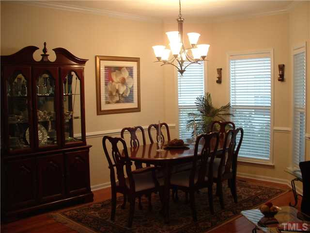 1908 Grace Point Road Morrisville, NC 27560 - Photo 4 of 22 Flow from your Living Room into the Spacious Dining Room (with extra floor space from the bay window); elegant lighting and chair rail moulding. Owners may have never eaten in here, so you can be the first! Dining Room