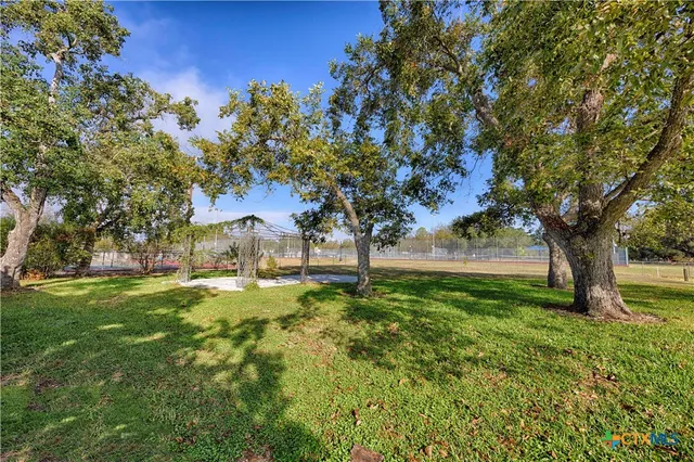 a view of backyard with green space
