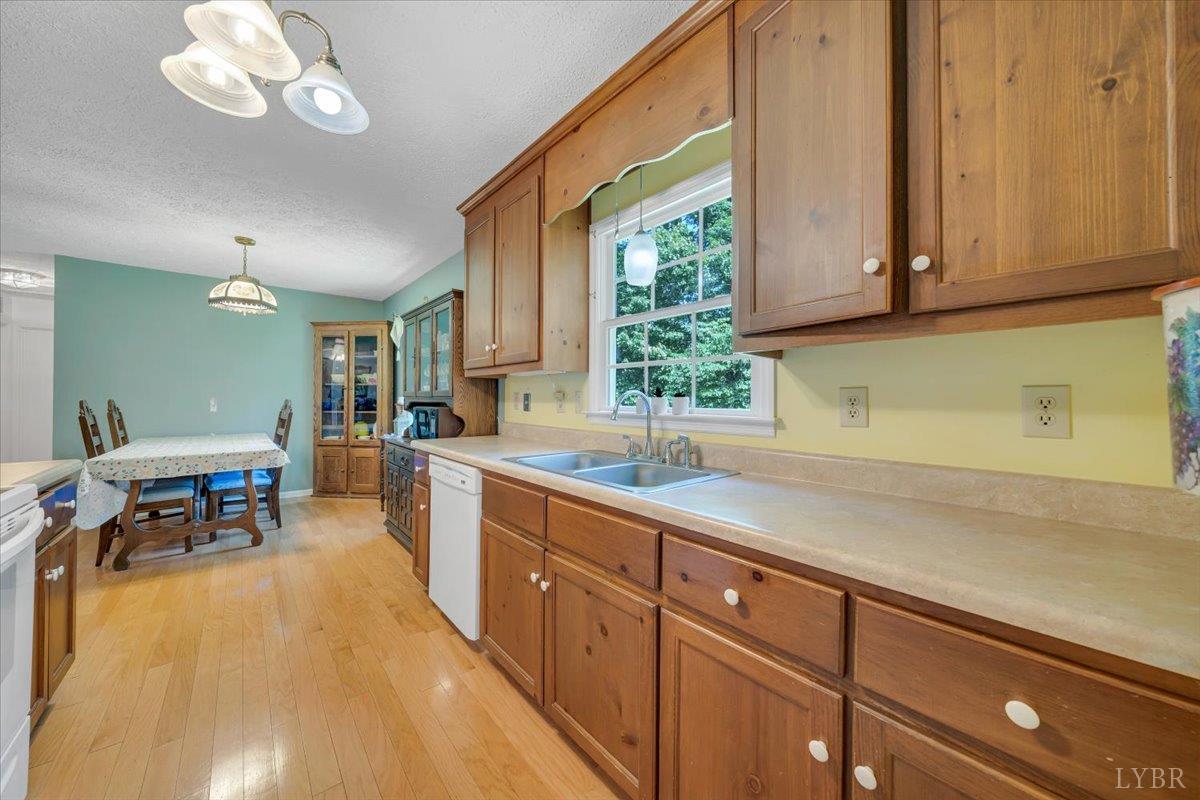 1124 Homeplace Road Bedford, VA 24523 - Photo 17 of 47 a kitchen with a sink and cabinets