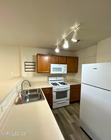 a kitchen with a refrigerator stove and sink