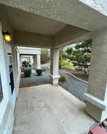 a view of a garden from a porch