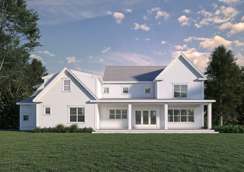 76 Martin Road Concord, MA 01742 - Photo 15 of 16 a front view of a house with a garden and trees