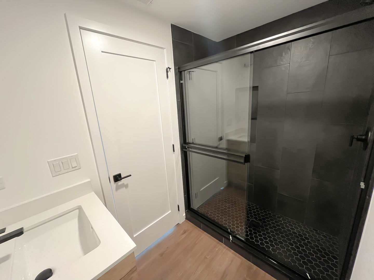 3710 North Kenmore Avenue, Unit 3 Chicago, IL 60613 - Photo 6 of 13 a bathroom with a glass shower door