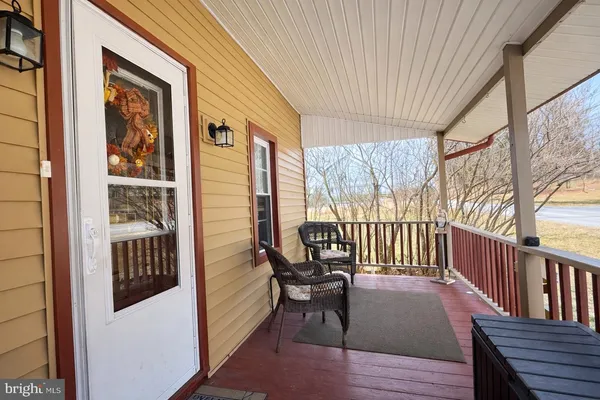 a view of a balcony with furniture