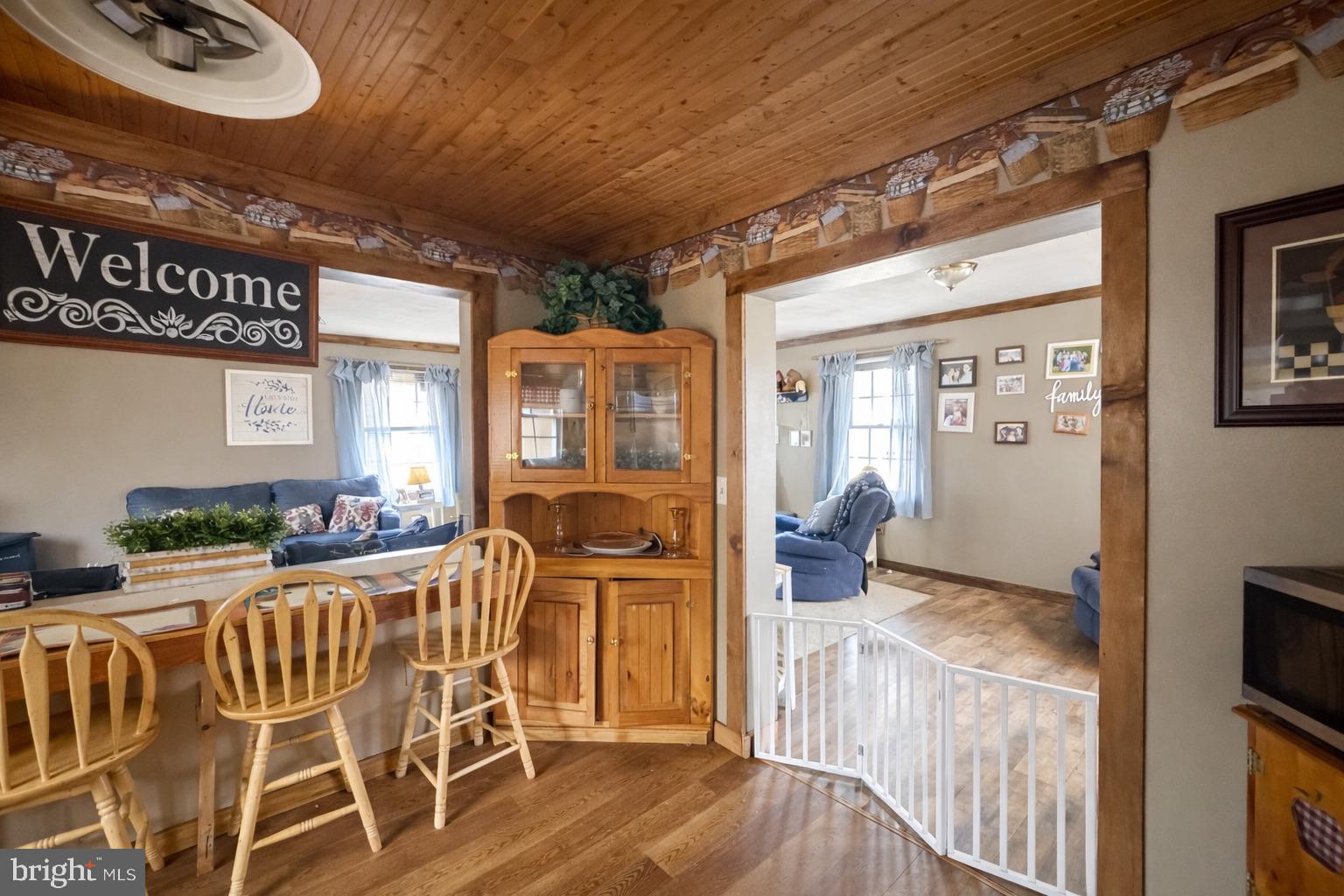 228 Rockey Road Loganton, PA 17747 - Photo 19 of 39 a view of a dining room with furniture window and wooden floor