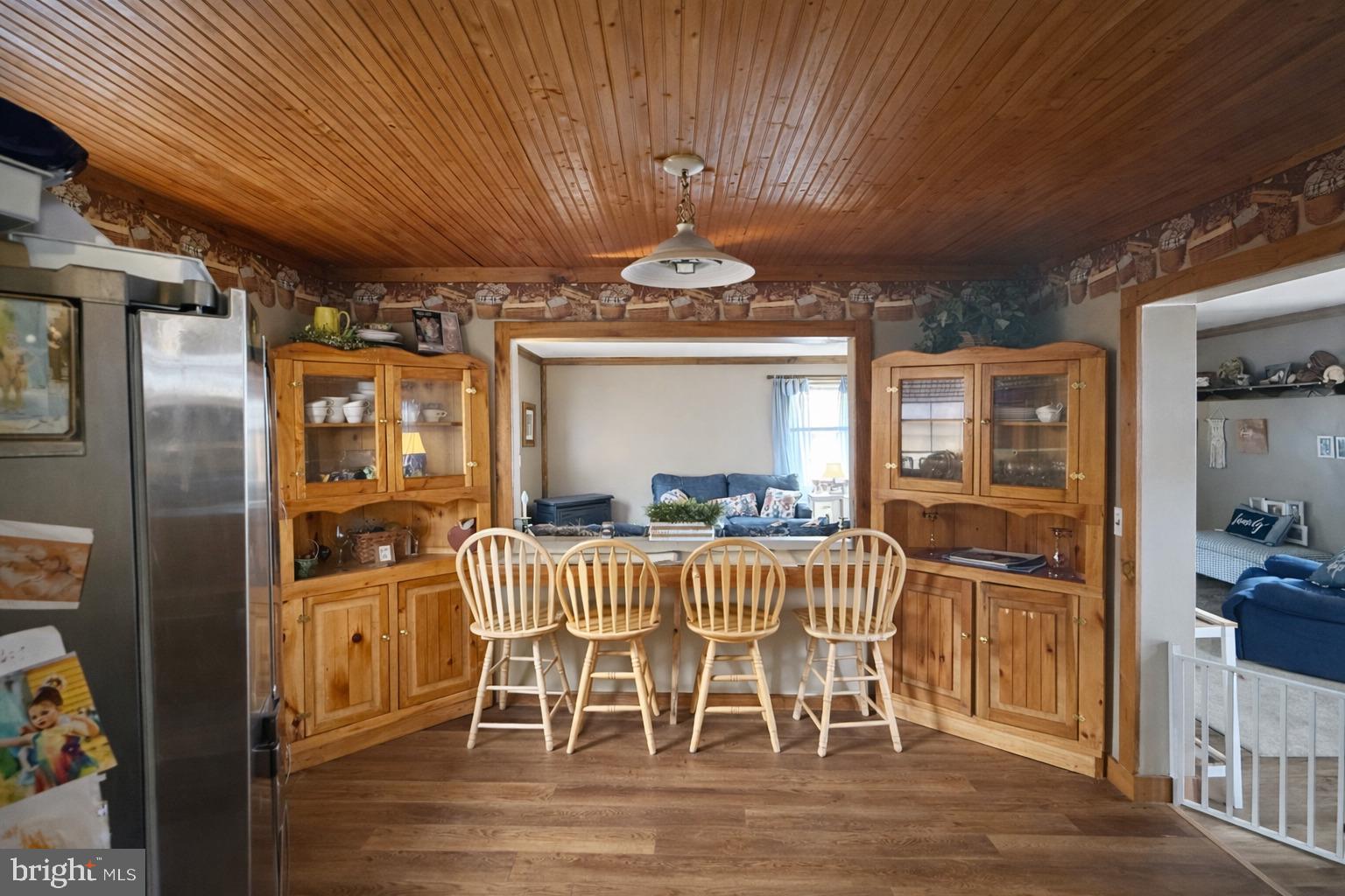 228 Rockey Road Loganton, PA 17747 - Photo 20 of 39 a view of a dining room with furniture window and wooden floor