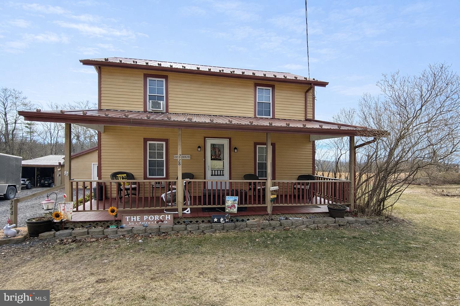 228 Rockey Road Loganton, PA 17747 - Photo 2 of 39 a front view of a house with garden