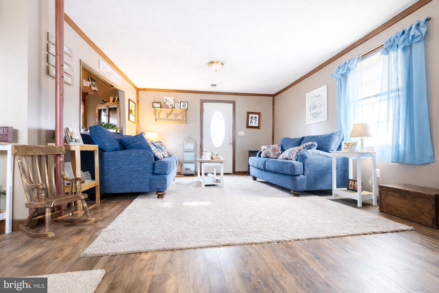 228 Rockey Road Loganton, PA 17747 - Photo 22 of 39 a living room with furniture large window and wooden floor