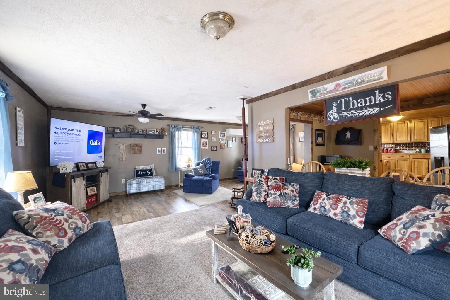 228 Rockey Road Loganton, PA 17747 - Photo 23 of 39 a living room with furniture and a flat screen tv