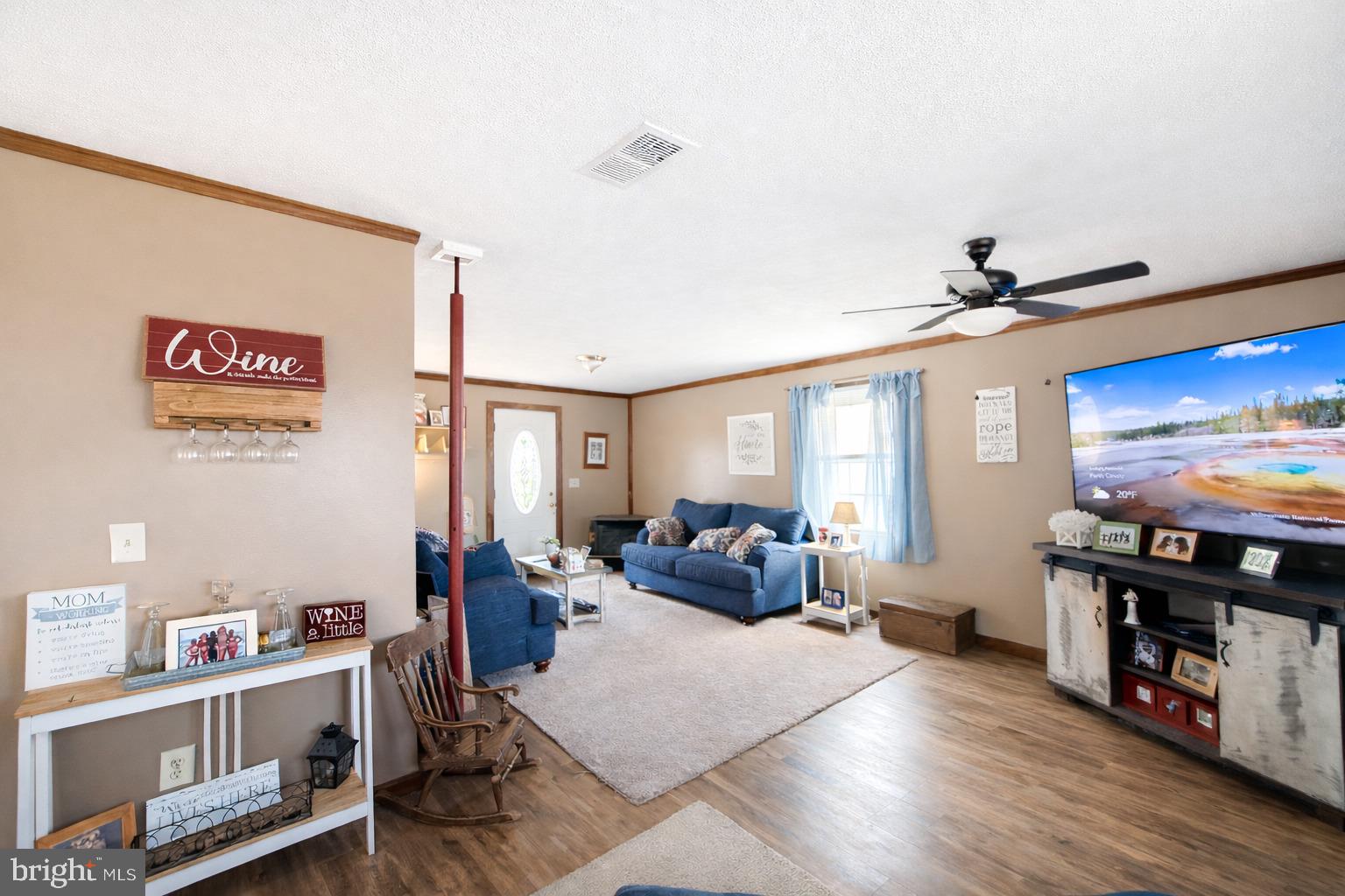 228 Rockey Road Loganton, PA 17747 - Photo 24 of 39 a living room with furniture and a flat screen tv