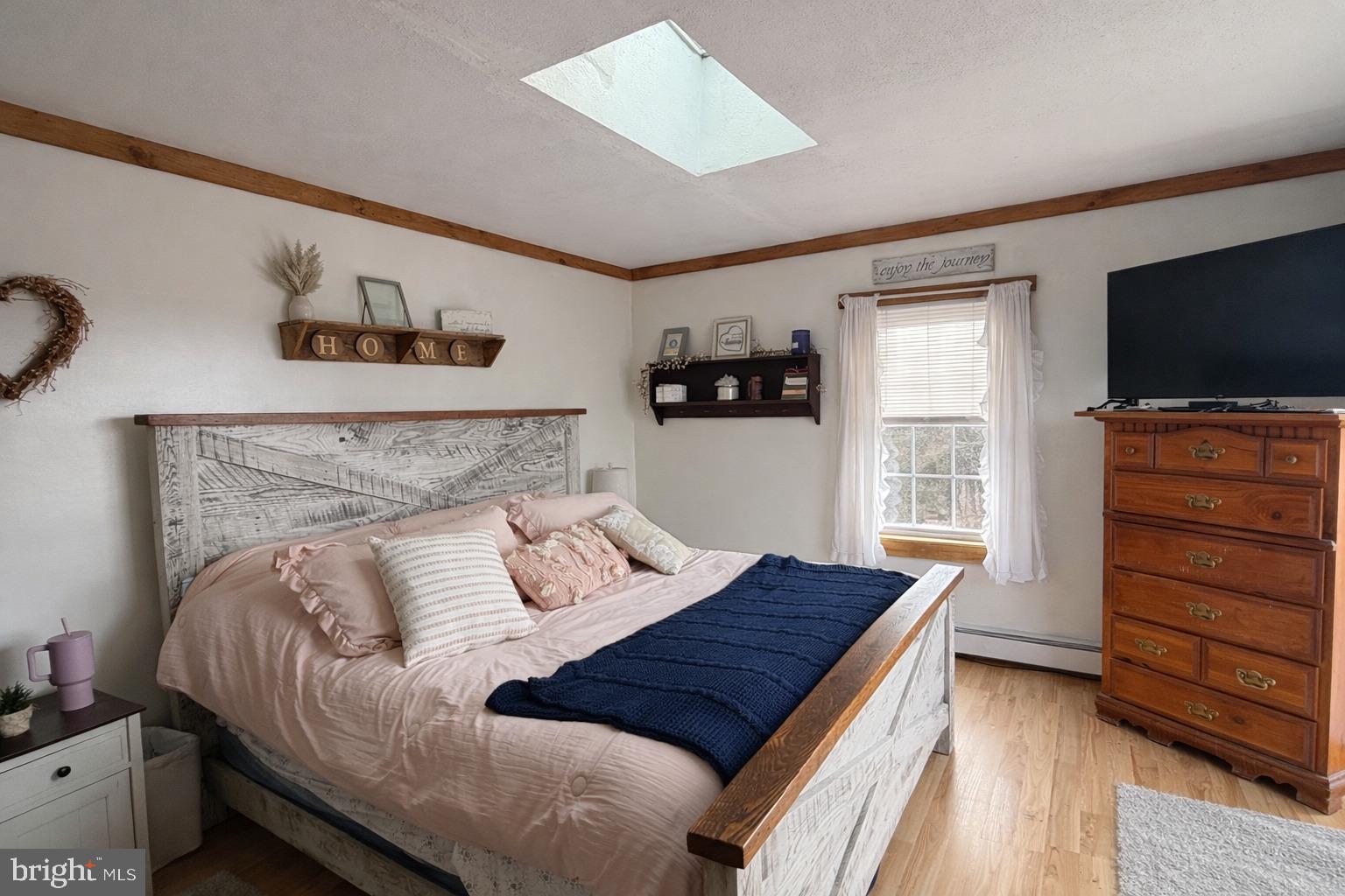 228 Rockey Road Loganton, PA 17747 - Photo 26 of 39 a bedroom with a bed and flat screen tv