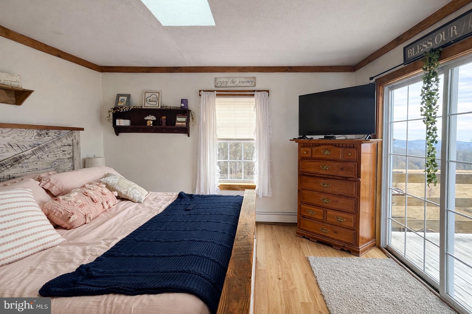 228 Rockey Road Loganton, PA 17747 - Photo 29 of 39 a bedroom with a bed and a television