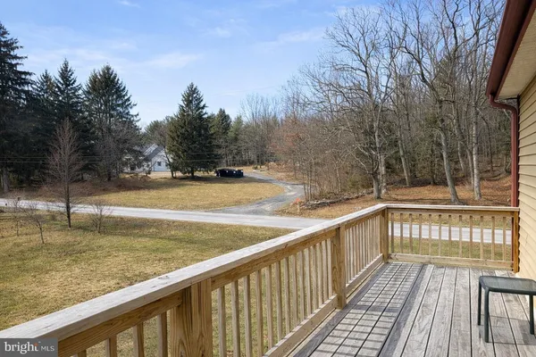 a view of a balcony with trees