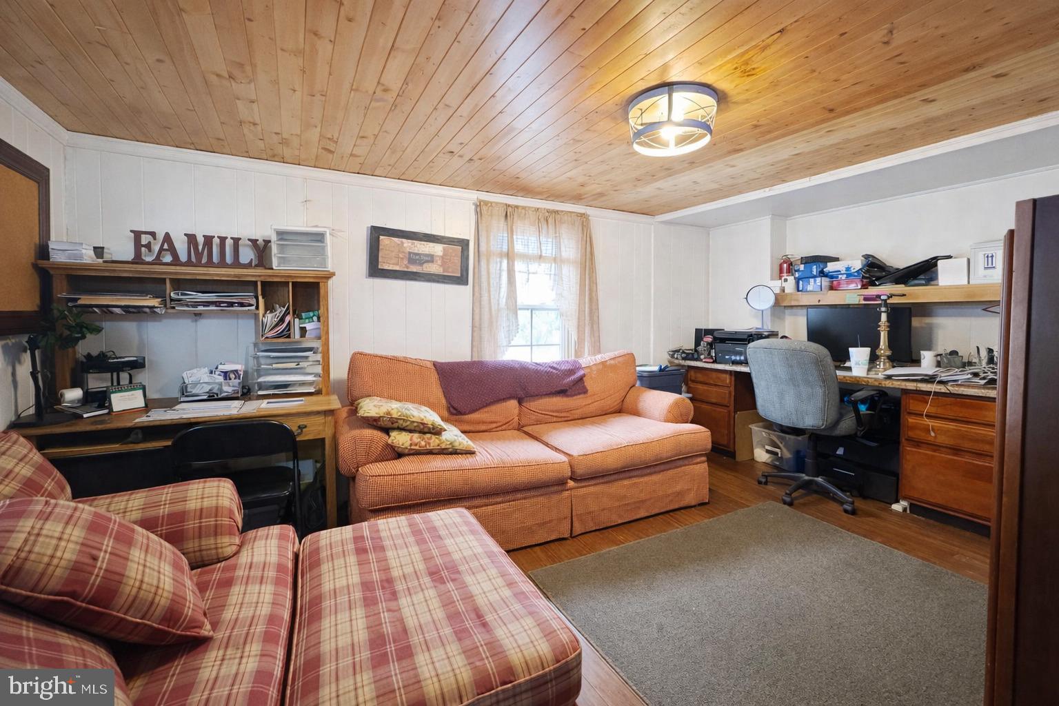 228 Rockey Road Loganton, PA 17747 - Photo 39 of 39 a living room with furniture and a chandelier