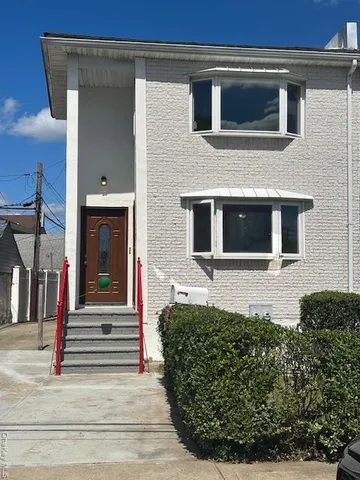 a front view of a house with a small yard