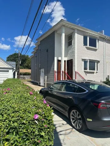 a front view of a house with yard